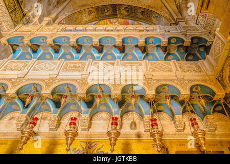 Gilded decorations and colorful mosaics on the interior walls in the Church of the Holy Sepulchre, Old City of Jerusalem, Israel. Stock Photo