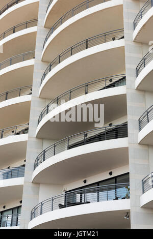 An abstract pattern of concrete balconies on an apartment building in St Julians Bay Malta - modern architecture Stock Photo