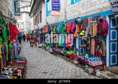 Climbing, trekking, and outdoor gear included in the any thing you need market in Namche Bazaar on the way to Mt. Everest, Nepal. Stock Photo