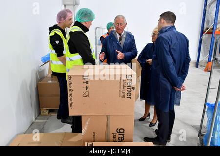 The Prince of Wales speaks to employees during a visit to Rachel's Organic in Aberystwyth, a company which produces organic yoghurt, where he will officially open the firm's new extension. Stock Photo