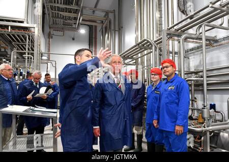 The Prince of Wales is joined by Richard Cooper, Plant Manager, during a visit to Rachel's Organic in Aberystwyth, a company which produces organic yoghurt, where he will officially open the firm's new extension, before meeting employees. Stock Photo