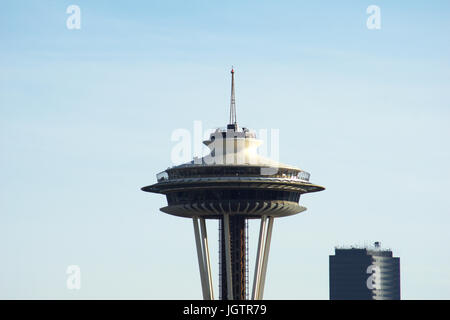 SEATTLE, WASHINGTON, USA - JAN 24th, 2017: Space Needle closeup of the top against cloudy sky as viewed from Kerry Park. Seattle is the largest city in both the State of Washington and the Pacific Northwest region of North America Stock Photo