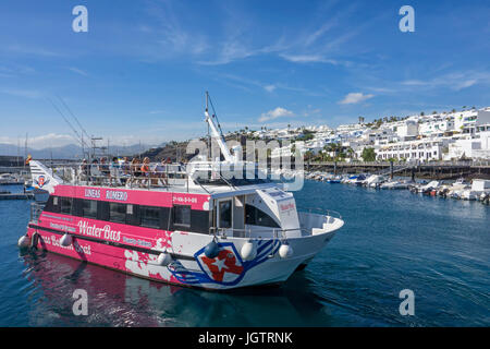 Water Bus Lineas Romero, touristic passenger ship for round trips at fishing harbour La Tinosa, Puerto del Carmen, Lanzarote, Canary islands, Europe Stock Photo