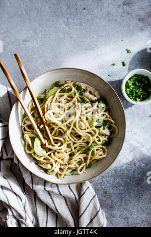 An Asian noodle salad in a ceramic bowl Stock Photo