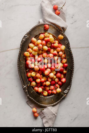 Cherries on a silver platter Stock Photo
