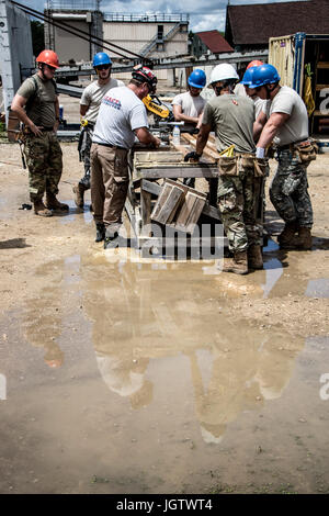Soldiers with the 1049th Firefighting Detachment (FFTD) install the ...