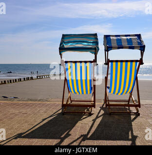 Deck chairs on the sea front Stock Photo