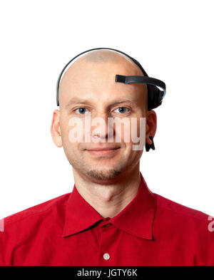 Portrait of young man with electroencephalography (EEG) headset on head. Isolated on white background. Stock Photo