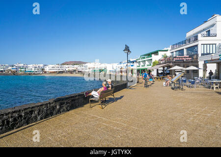 Promenade with restaurants and shops at Playa Blanca, Lanzarote island, Canary islands, Spain, Europe Stock Photo
