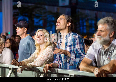 Montreal, 2 July 2017: Couple enjoying a live performance at Montreal Jazz Festival Stock Photo