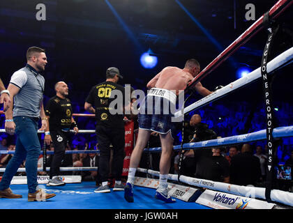 Saturday 8th of July 2017: Boxing, Braehead Arena, Glasgow, Scotland. Prestonpans boxer Josh Taylor defeats Hackney's Ohara Davies to add the WBC Silver belt to his Commonwealth title. The 26-year-old earned his tenth and most satisfying victory of his short career in an explosive night at GlasgowÕs Braehead Arena, a win that propels the Prestonpans puncher into the top 15 in the world super lightweight rankings.  Josh celebrates with with his team in the ring after the fight and calls out to fellow Scottish boxer, Ricky Burns, 'you're next'! Stock Photo