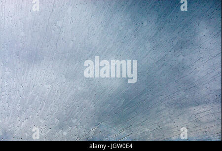 Splattered raindrops on the windshield of a small airplane. Stock Photo