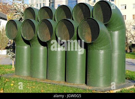 Green industrial pipes for ventilation above the ground Stock Photo