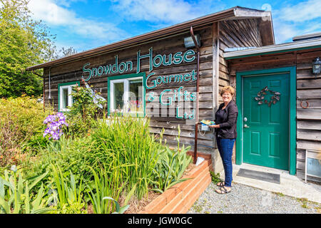 Laura Waters at her shop, Snowdon House outside Victoria, BC, Canada on Vancouver Island, where she sells edibles made from new growth on douglas fir  Stock Photo