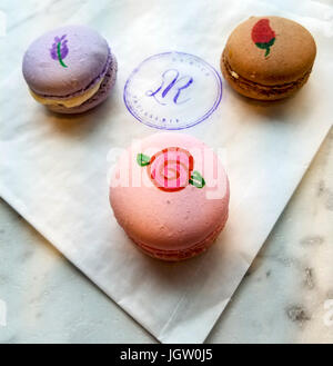 Three "macarons" (meringue filled with cream) sold at La Roux Patisserie in Victoria's Chinatown. Vancouver Island, BC, Canada. Stock Photo