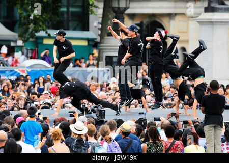 London, UK - August 9, 2015: A group of Korean hip hop dancers showing performance in the Korean Festival at Trafalgar Square, spectators present. Stock Photo