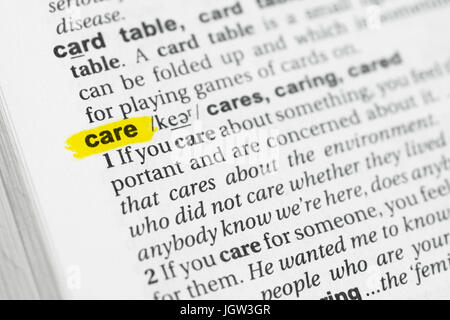 Highlighted English word 'care' and its definition at the dictionary. Stock Photo