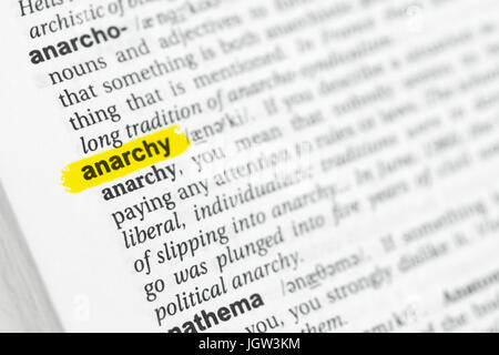 Highlighted English word 'anarchy' and its definition at the dictionary. Stock Photo