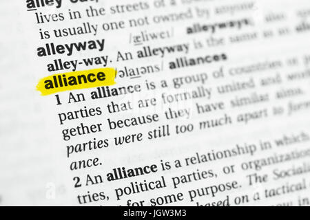 Highlighted English word 'alliance' and its definition at the dictionary. Stock Photo