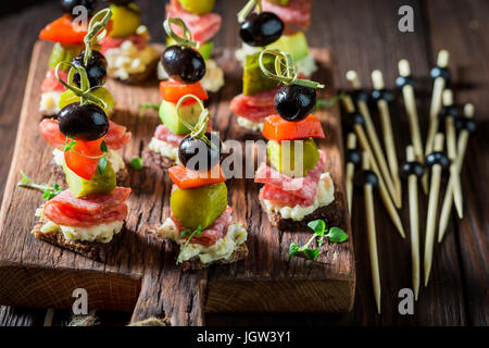 Various snack with ingredients on wooden table Stock Photo