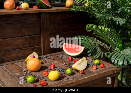 Fruits and berries on the white wooden table, top view Stock Photo