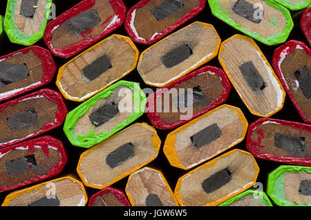 mixed color carpenter stacked pencil ends background macro Stock Photo