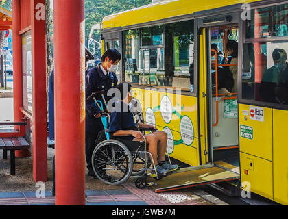 NARA, JAPAN - NOVEMBER 16: Loop Bus in Nara, Japan on November 16, 2013. Provides people and sliding slope from the bus to help handicapped people Stock Photo