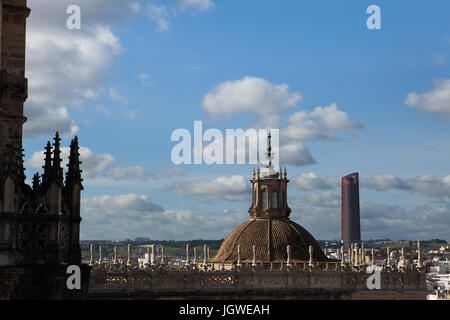 Sevilla Tower (Torre Sevilla) and the dome of the Cathedral Tabernacle (El Sagrario de la Catedral) pictured from the Giralda Tower of the Seville Cathedral (Catedral de Sevilla) in Seville, Andalusia, Spain. Stock Photo