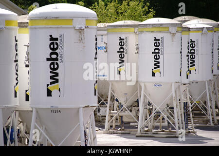 Mainz, Germany - June 10, 2017: Building material silos from the company Weber on the industrial site of Heidelberg cement on June 10, 2017 in Mainz. Stock Photo