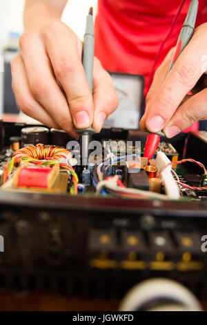 REPAIRING ELECTRONICS WITH TEST EQUIPMENT Stock Photo
