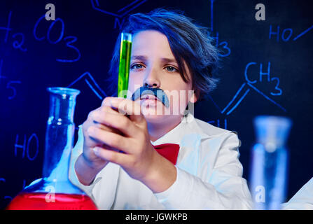 Adding magic ingredient in laboratory Stock Photo