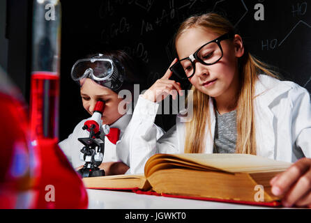 Two little scientists in laboratory Stock Photo
