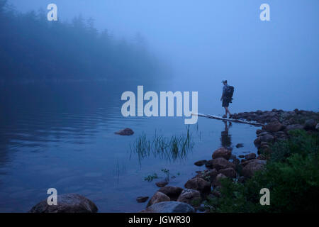 Male hiker by misty river, Acadia, Maine, USA Stock Photo
