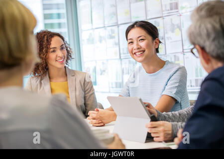 Digital design team discussing ideas  at conference table Stock Photo