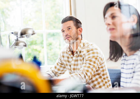 Two  designers having meeting at desk in creative studio Stock Photo