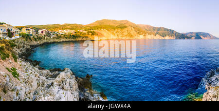 Assos village from cliffs site on evening sunset in Kefalonia, Greece Stock Photo