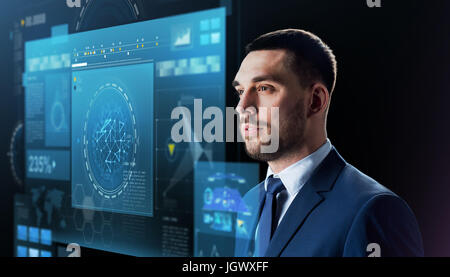 businessman with virtual screen over black Stock Photo
