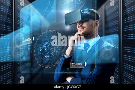 businessman in virtual reality headset with charts Stock Photo
