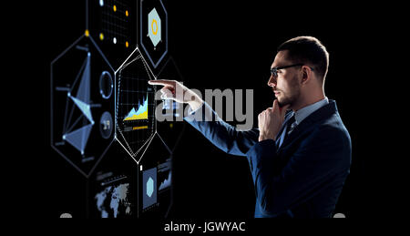 businessman with virtual screen over black Stock Photo