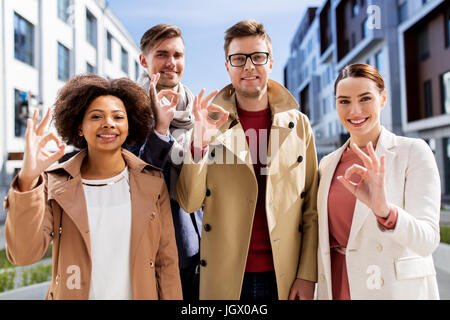 international business team showing ok hand sign Stock Photo - Alamy