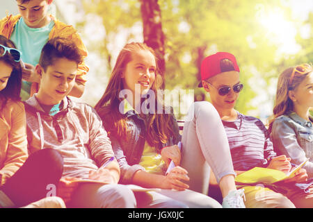 group of students with notebooks at school yard Stock Photo