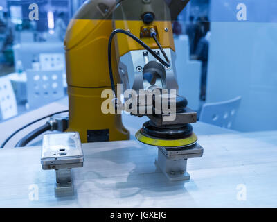 Industrial robot working in phone factory Stock Photo