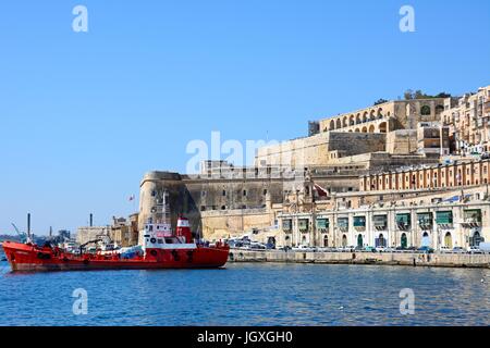 Oil tanker in the Grand Harbour with the Saluting Battery and Upper Barrakka gardens at the top, Valletta, Malta, Europe. Stock Photo