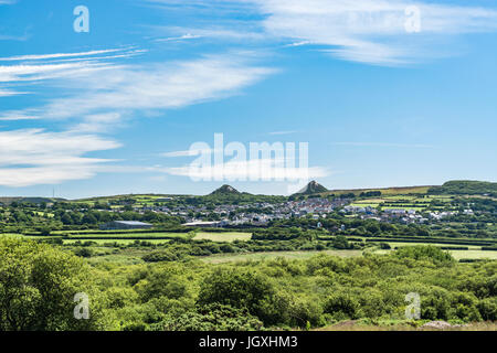 The village of St. Dennis seen distantly through shimmering heat of summer sun. Stock Photo