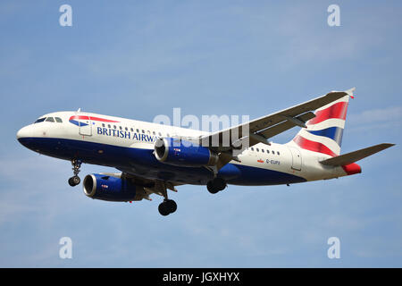 British Airways Airbus A319-100 G-EUPX landing at Heathrow Airport, UK