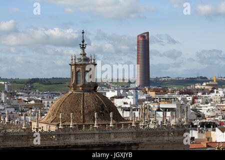 Sevilla Tower (Torre Sevilla) and the dome of the Cathedral Tabernacle (El Sagrario de la Catedral) pictured from the Giralda Tower of the Seville Cathedral (Catedral de Sevilla) in Seville, Andalusia, Spain. Stock Photo