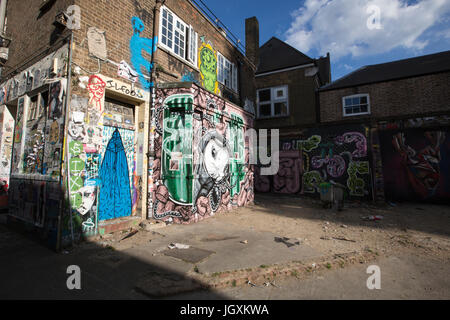 Street art murals including 'President Evil' depicting Donald Trump, by artist Tom Blackford, Brick Lane, East London, UK Stock Photo