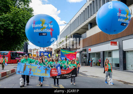 Bristol, UK, 5th July, 2016. Striking teachers and their supporters are pictured as they make their way through the city centre during a march and ral Stock Photo