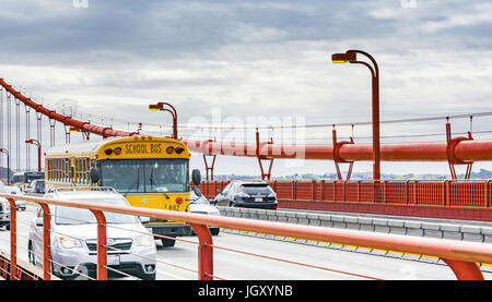 San Francisco, CA, USA, october 24th, 2016: School Bus moving in the traffic on the Golden Gate Bridge Stock Photo