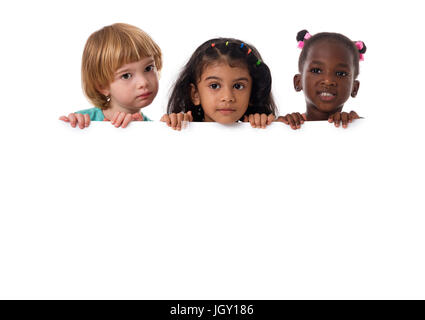 Group of multiracial kids portrait in studio with white board.Isolated Stock Photo